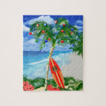 Beach Christmas Jigsaw Puzzle<br><div class="desc">Happy Holidays from the warm sandy beaches of your favorite tropical island beach. Palm tree decorated with Christmas ornaments and lights,  with a retro surfboard leaning against the Christmas tree.</div>