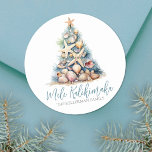 Beach Christmas Mele Kalikimaka Classic Round Sticker<br><div class="desc">Mele Kalikimaka Beach Christmas Tree Classic Round Sticker. Spread some beachy holiday cheer with this unique round sticker featuring a Christmas tree made of shells and starfish. The tree, topped with a starfish, is designed in calming blue and green hues, reminiscent of underwater coral, and is set against a sandy...</div>