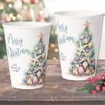 Beach Christmas Paper Cups<br><div class="desc">Celebrate the season with these festive and beachy paper cups, perfect for a Merry Christmas gathering. The design features a whimsical Christmas tree made of beach shells, starfish, and coral, displayed on both the front and back of the cup to bring coastal charm from every angle. The soft teal blue...</div>