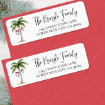 Beach Christmas Return Address Label<br><div class="desc">Add a tropical and festive touch to your holiday mail with this whimsical return address label sticker featuring a watercolor palm tree on the left side, decorated with twinkling holiday lights and a few hanging stockings. A soft hint of beach sand grounds the scene, adding a relaxed coastal vibe. On...</div>