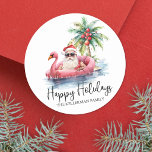 Beach Christmas Santa Happy Holidays Classic Round Sticker<br><div class="desc">Happy Holidays Tropical Beach Santa Classic Round Sticker. Celebrate the season with a tropical twist using this fun round sticker. Featuring a laid-back Santa Claus in sunglasses, lounging on a pink flamingo floaty in the ocean, this sticker brings a beachy vibe to your holiday. The design includes a palm tree...</div>