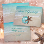 Beach Christmas Starfish Seas n Greetings Card<br><div class="desc">Seas and greetings tropical Christmas card with custom greeting and message inside. Folded cards come in three sizes and have a starfish and tree ornament on the front over a tropical scene of turquoise sea water and beach sand. Also add a signature. Text on front can be changed to "Merry...</div>