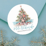 Beach Christmas Tree Mele Kalikimaka Classic Round Sticker<br><div class="desc">Mele Kalikimaka Beach Christmas Tree Classic Round Sticker. Spread some coastal cheer with this festive round sticker featuring a beach-inspired Christmas tree made of seashells and a starfish topper. Perfect for sending tropical holiday wishes, this sticker is great for anyone living in sunny places like Hawaii or who loves a...</div>