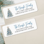 Beach Christmas Tree Return Address Label<br><div class="desc">This festive return address label features a charming Christmas tree in soft blue and white tones for a cool, coastal-inspired holiday look. The tree rests on a light sandy base, giving it a subtle beachy touch. On the right, your name and address appear in a mix of blue and dark...</div>