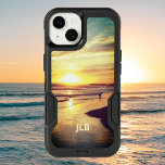 Beach Dog in California Surf Personalized OtterBox iPhone 14 Case<br><div class="desc">A dog plays in the Pacific surf as the last golden rays of the sun slide over the mountains and turn the beach golden. This OtterBox case features a photo of a California beach at sunset so you can take a bit of surf and sand with you wherever you go....</div>