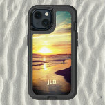 Beach Dog in Surf OtterBox iPhone 14 Case<br><div class="desc">A dog plays in the Pacific surf as the last golden rays of the sun slide over the mountains and turn the beach golden. This OtterBox case features a photo of a California beach at sunset so you can take a bit of surf and sand with you wherever you go....</div>