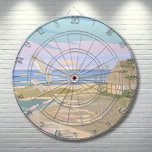 Beach House Dart Board<br><div class="desc">Transport yourself to the serene coastal bliss of a summer's day with this art print dart board, capturing the essence of a tranquil beach scene. The soft pastel hues of blue, pink, purple, tan and creams, evoke the calming aura of a coastal sunset or sunrise, where the ocean's gentle surf...</div>