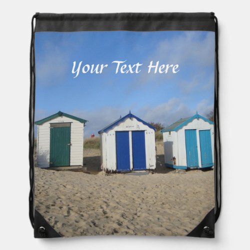 beach huts blue sky and sand english seaside drawstring bag