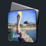 Beach Pier Pelican Bird Photo Sun Day Quote Script Laptop Sleeve<br><div class="desc">This happy pelican perched on a railing overlooking a California beach screams “vacation ready”. Drift back to the warm ocean breezes whenever you use this colorful photography neoprene laptop sleeve. This laptop sleeve comes in three sizes: 15", 13", and 10”. Makes a great gift for someone special! You can easily...</div>