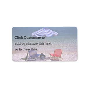 Beach scene with resting chairs label