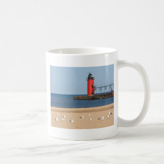 Beach scene with seagulls and lighthouse coffee mug