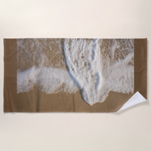 Beach towel with image of white wash on beach