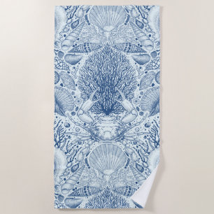 Beach treasures in blue beach towel