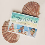 Beach Vacation Happy Holidays Coastal 3-Photos Holiday Card<br><div class="desc">Send warm season's greetings with this beach-themed Christmas card. The coastal holiday photo cards features a sea green watercolor wave upon a sandy shore. Script lettering atop the wave reads "Happy Holidays" in a pretty blue-green ocean color. Three photos are placed below the painted wave. To personalize, add your names...</div>
