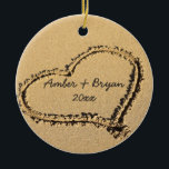 Beach Wedding | 1st Christmas Together Add Names Ceramic Ornament<br><div class="desc">Romantic personalized beach theme Christmas ornament for the new bride and groom celebrating their first Christmas together as newlyweds is ready to be personalized with the bride and groom names and Christmas year. Beach photo shows a heart drawn in the sand on the beach. In the middle is where it...</div>