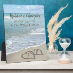 Beach Wedding Hearts in the Sand Elegant Plaque<br><div class="desc">Two interlocking beach wedding hearts drawn in the sand makes an elegant tropical ocean coastal nautical theme wedding,  matching set of items. Pretty turquoise water waves crashing on the shore and pastel blue sky.</div>