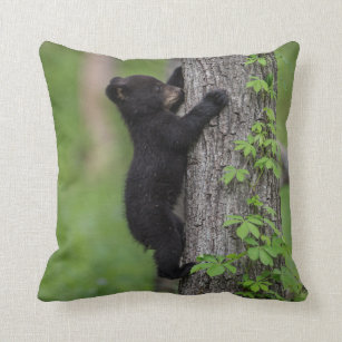 Bear Cub Climbing a Tree Throw Pillow