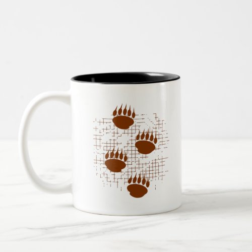 Bear Cub Paw Prints On Distressed Background Two_Tone Coffee Mug