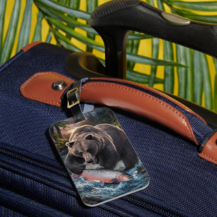 Bear holding a shimmering fish luggage tag