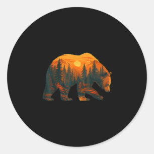 Bear silhouette with forest landscape and sunset classic round sticker