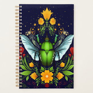 Beatle and flowers on dark blue planner