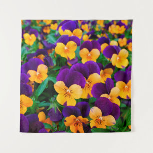 Beautiful blooming pansies in the garden tapestry