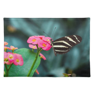 Beautiful butterfly on a pink flower cloth placemat
