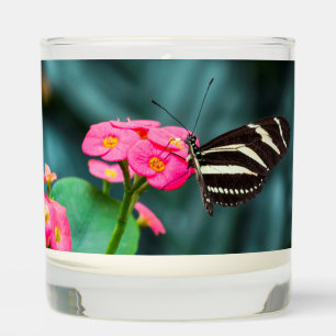 Beautiful butterfly on a pink flower scented candle