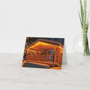 Beautiful Christmas Lights On Log Cabin In Snow Holiday Card by UniqueChristmasGifts at Zazzle