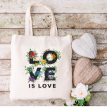 Beautiful Floral Love Is Love Pride Tote Bag<br><div class="desc">Pride tote bag with LOVE IS LOVE written in bold black letters decorated with greenery,  berries,  and flowers in red,  orange,  yellow,  green,  blue,  and purple,  inspired by the rainbow pride flag colors.</div>