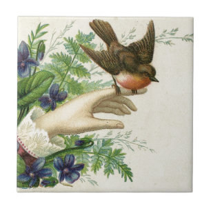 Beautiful hand with a bird and flowers tile