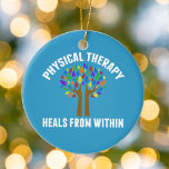 Beautiful Physical Therapy Inspirational Quote Ceramic Ornament<br><div class="desc">Physical Therapy Heals From Within. A cute physical therapist quote gift with a beautiful tree with rainbow leaves and helping hands as the tree limbs that lift them up. Motivational and beautiful present for a PT.</div>