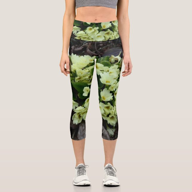 Beautiful Primula vulgaris Primroses in dry leaves Capri Leggings (Front)