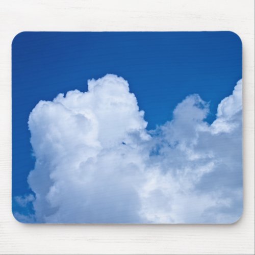 Beautiful puffy clouds in blue sky mouse pad