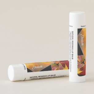 Beautiful red vine leaves in the autumn garden lip balm