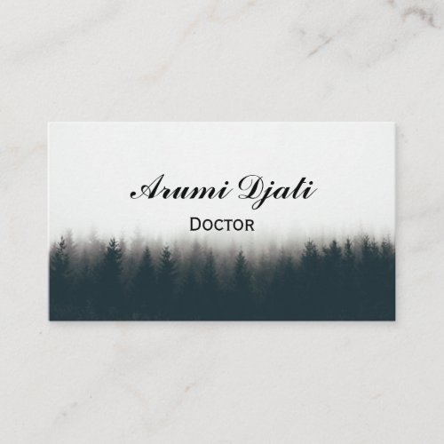 Beautiful shot of a thick forest in fog with pine  business card