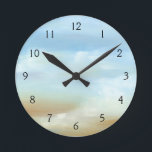 Beautiful Skyscape with Fluffy Clouds Round Clock<br><div class="desc">Doesn’t this skyscape just make you want to go outside and look up? Fluffy clouds float across a beautiful blue skyscape,  making it feel as if you are looking out of a plane window. Purchase a copy today!</div>