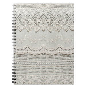 Beautiful, subtle, white laced textile close up.  notebook