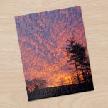 Beautiful Sunrise Clouds Photo Jigsaw Puzzle<br><div class="desc">Beautiful pink and light orange clouds nearly cover a lavender sunrise sky beyond small black trees in the distance. One tall pine tree stands in silhouette on the right side of the frame. The yellow morning sun peeks through clouds near the horizon. To see the photograph Beautiful Sunrise Sky on...</div>