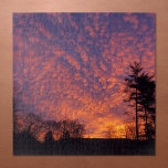Beautiful Sunrise Sky with Clouds Jigsaw Puzzle<br><div class="desc">Soft pink and light orange clouds nearly cover a beautiful lavender sunrise sky beyond small black trees in the distance. One tall pine tree stands tall in silhouette on the right side of the frame. The yellow morning sun peeks through clouds near the horizon. To see the photograph Beautiful Sunrise...</div>