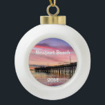 Beautiful Sunset at Newport Beach Ceramic Ball Christmas Ornament<br><div class="desc">This ornament makes a unique keepsake to remember any visit to fabulous Newport Beach.  Change the date to the current year.  The font style can be changed as well as the size,  color and location.  Three options for the back image also.</div>