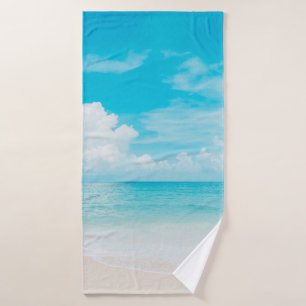 Beautiful tropical beach with blue sky and white c bath towel