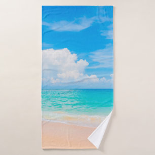 Beautiful tropical beach with blue sky and white c bath towel