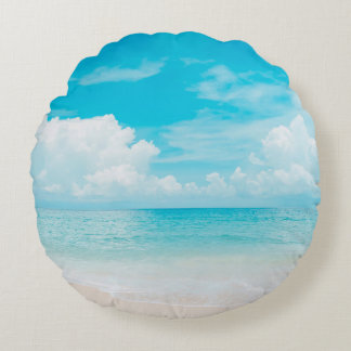 Beautiful tropical beach with blue sky and white c round pillow