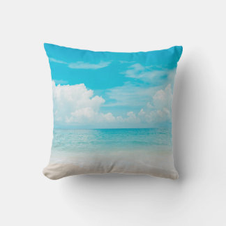 Beautiful tropical beach with blue sky and white c throw pillow