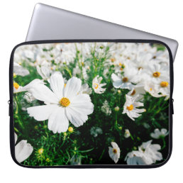 Beautiful white cosmos flowers blooming in gardena laptop sleeve