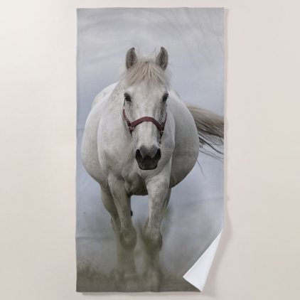 Beautiful white horse in mist beach towel