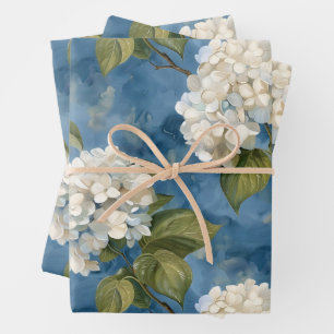Beautiful white hydrangea on blue wrapping paper sheets