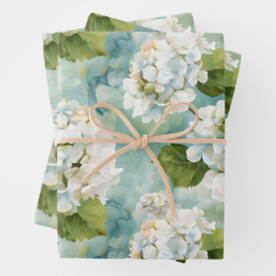 Beautiful white hydrangea on blue wrapping paper sheets