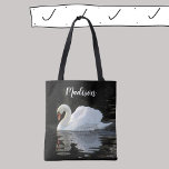 Beautiful white mute swan, reflections, your name tote bag<br><div class="desc">Both sides of this all over print tote bag feature an elegant white mute swan, and you can personalize the front with your name. The photo has been digitally enhanced to bring out the whiteness of the swan against the dark black water of the canal it is swimming on. The...</div>